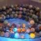 Azurite, hackmanite and chrysocolla crystal/mineral beaded bracelet under UV light to show the orange reactivity