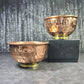 Two copper bowls with a textured finish on a gray surface - Dark Star Curiosities