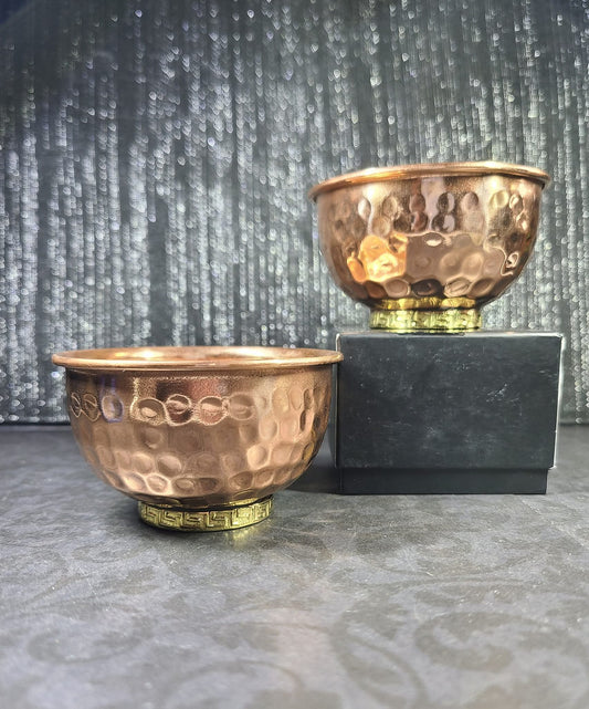 Two copper bowls with a textured finish on a gray surface - Dark Star Curiosities