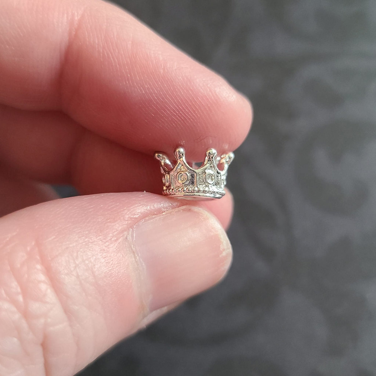 Miniature micro crowns for display and sphere stands in multiple color options. 