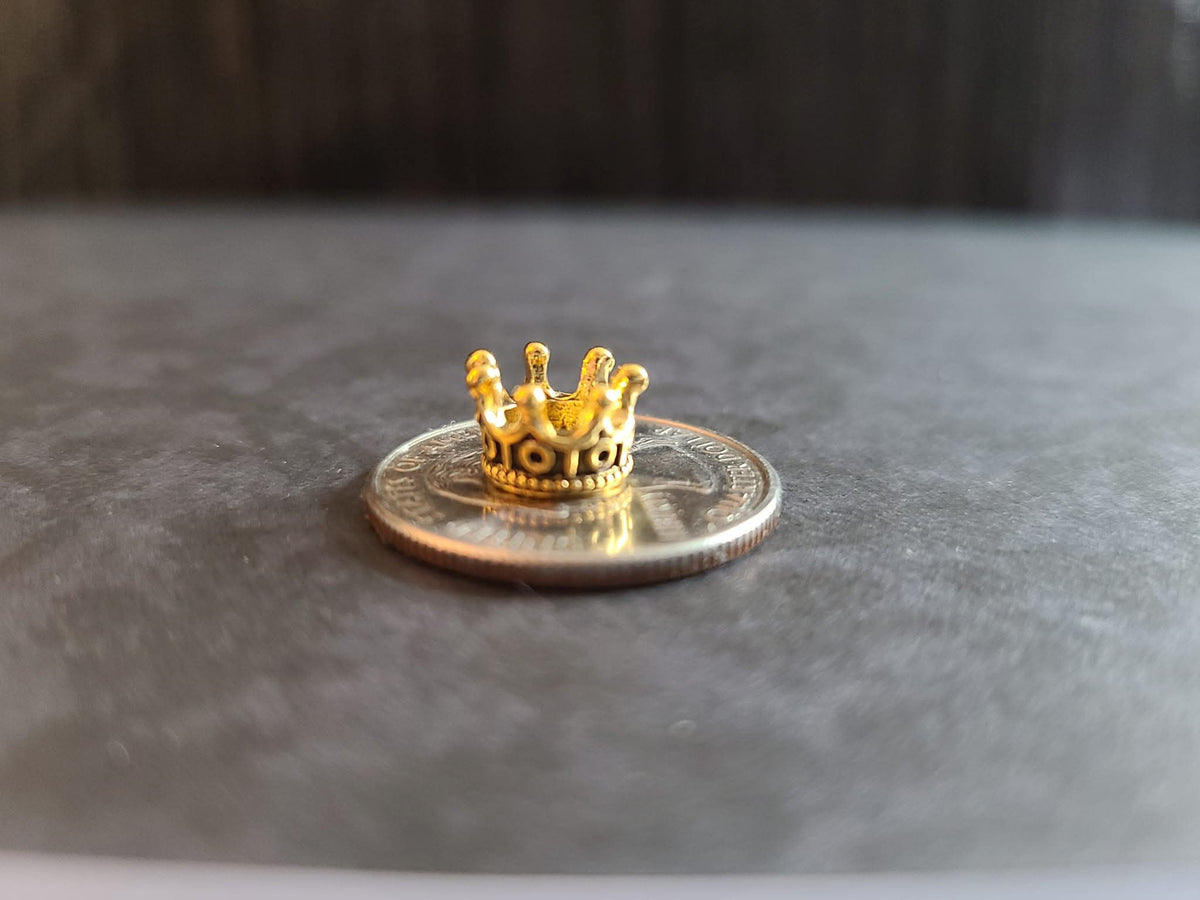 Miniature micro crowns for display and sphere stands in multiple color options. 