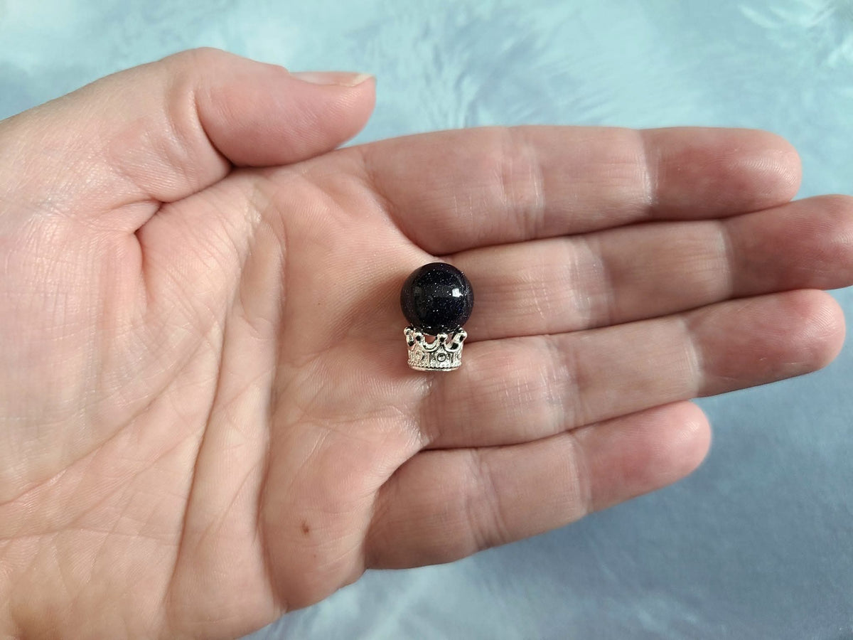 Miniature micro crowns for display and sphere stands in multiple color options. 